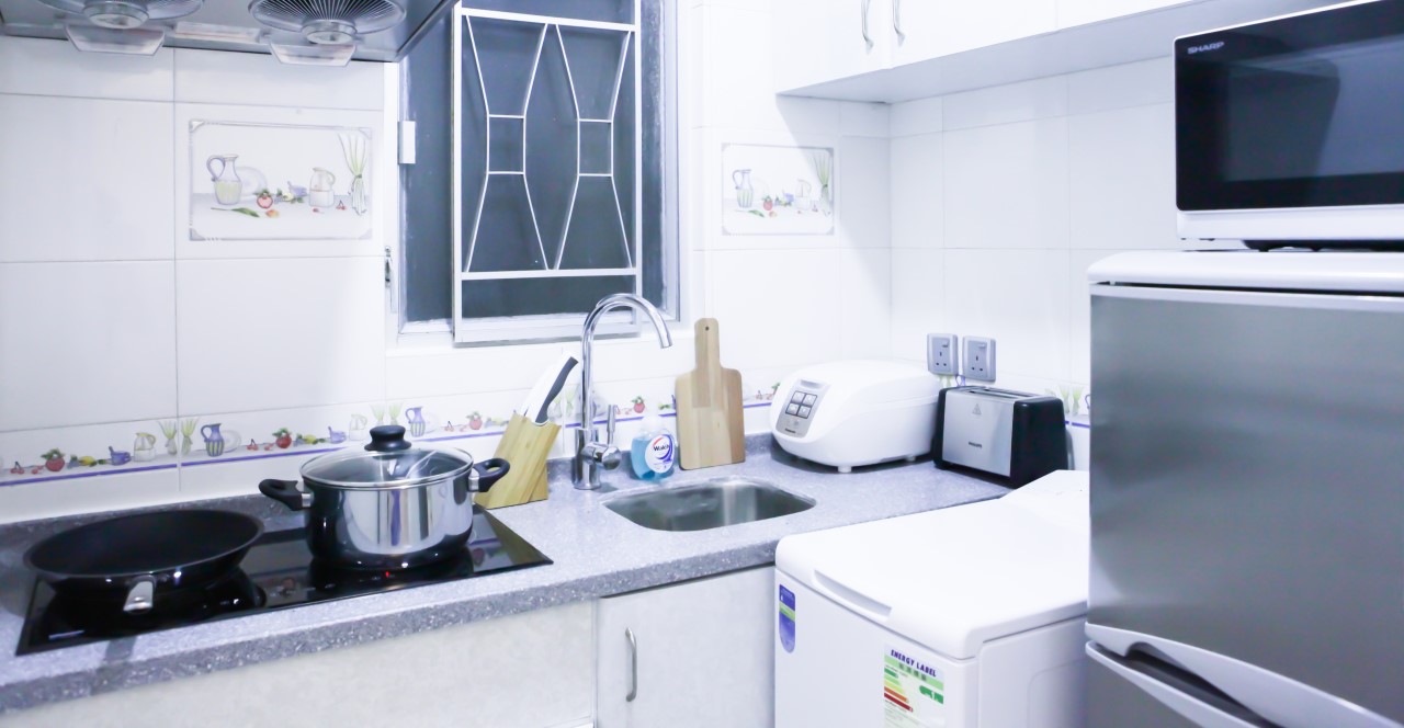 Modern full kitchen in 2 bedrooms serviced apartment Hong Kong Fortress Hill with electric stove