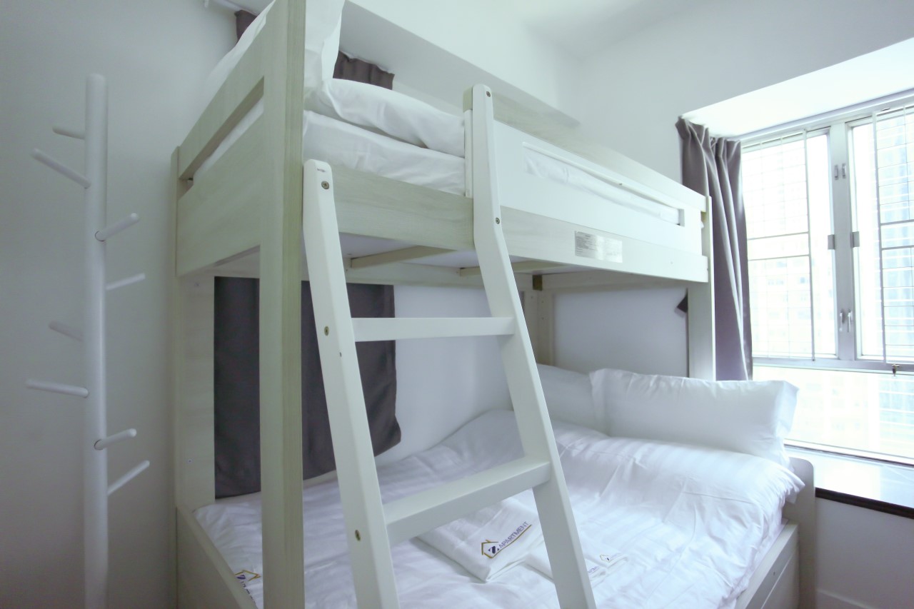 Bunk bed ( double bed size) facing windows in Fortress Hill 2 BR serviced apartment