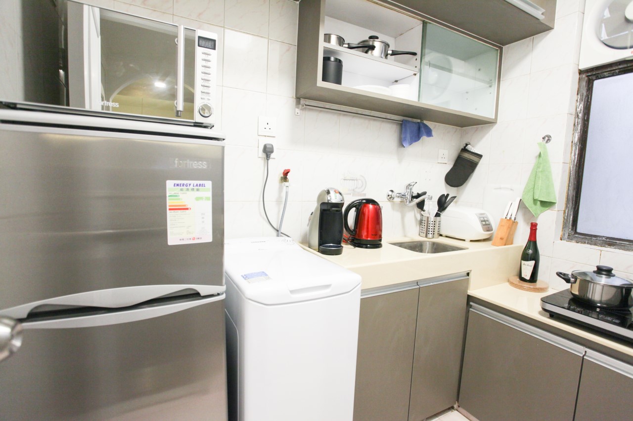 Modern kitchen in 2 bedrooms serviced apartment Hong Kong Fortress Hill with electric stove