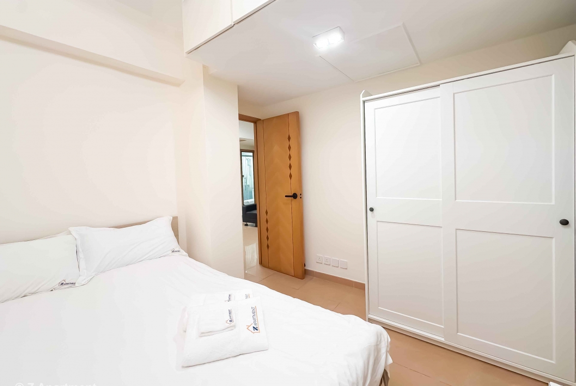 Queen size bed with white wardrobe combination in Tin Hau 2 bedrooms serviced apartment Hong Kong