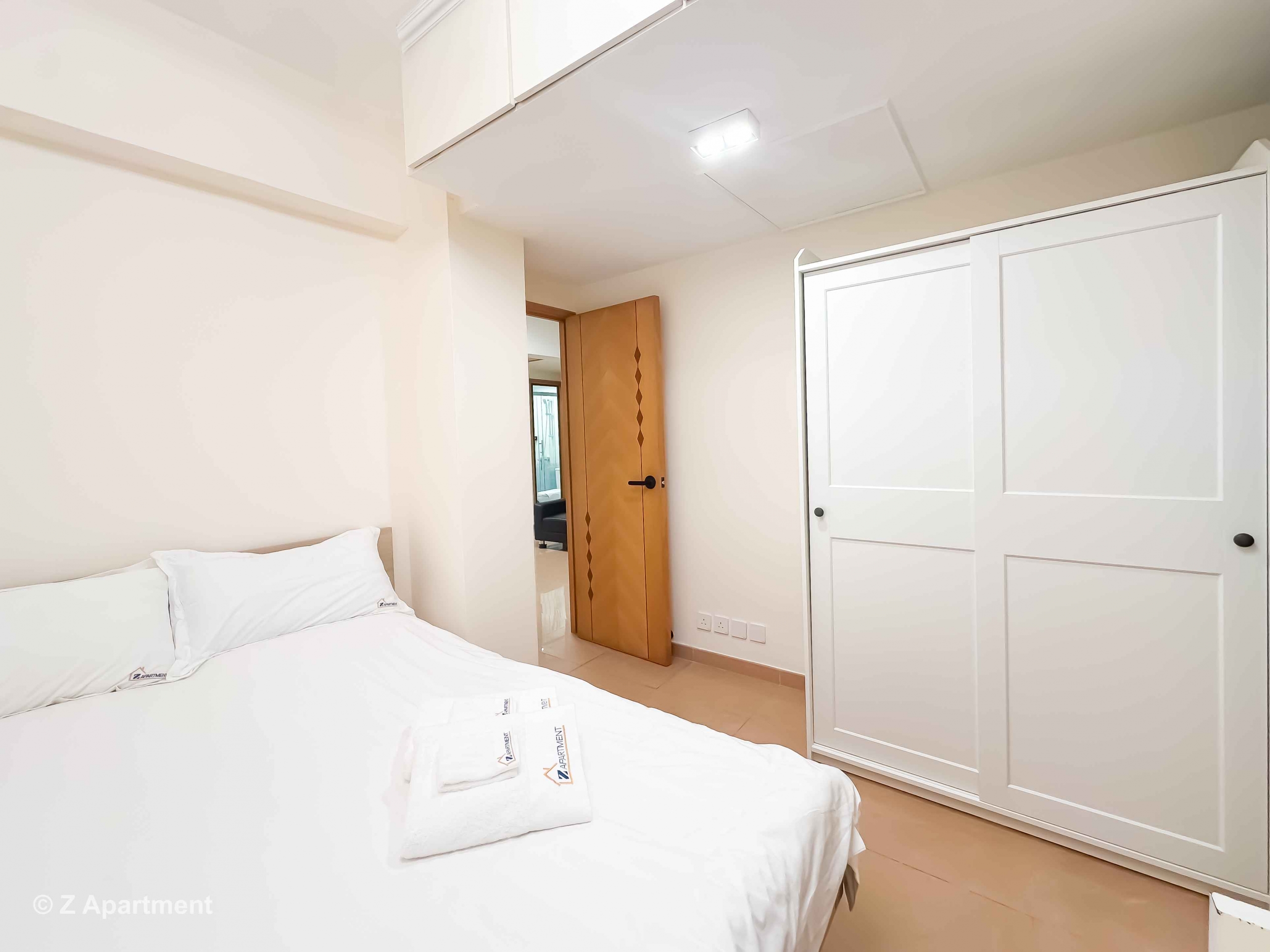 Queen size bed with white wardrobe combination in Tin Hau 2 bedrooms serviced apartment Hong Kong