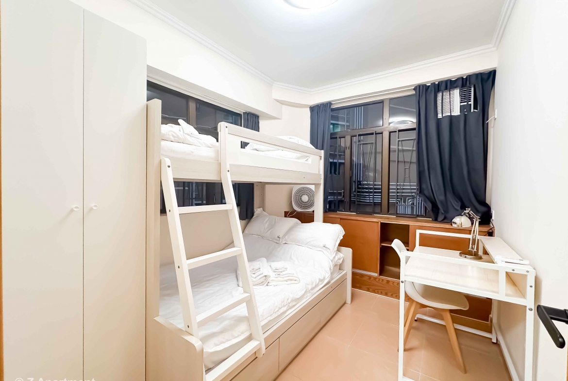 Bunk bed facing window with white wardrobe, working desk in Tin Hau 2 bedrooms serviced Apartment Hong Kong