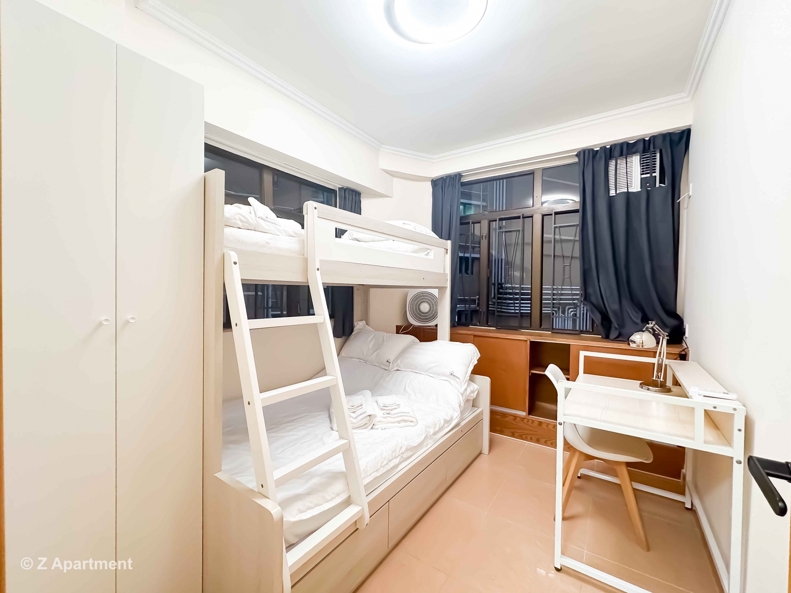 Bunk bed facing window with white wardrobe, working desk in Tin Hau 2 bedrooms serviced Apartment Hong Kong