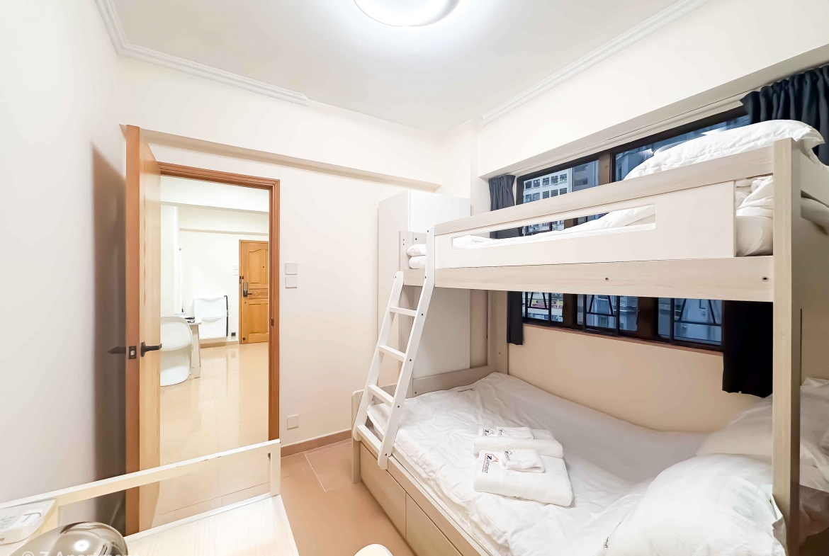 Bunk bed facing window with white wardrobe, working desk in Tin Hau 2 bedrooms serviced Apartment Hong Kong